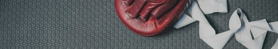 Boxing Glove and Bandages on Gym Floor Boxing Glove and Bandages on Gym Floor