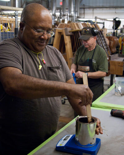 Man Using Dune to Mix Pigments