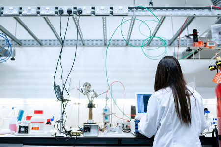 Female Scientist Conducting Test with Laboratory Equipment